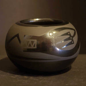 Avanyu design on a black on black jar