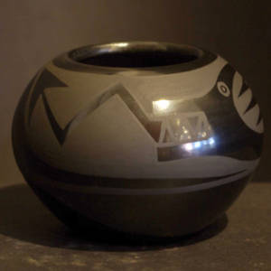 Avanyu design on a black on black jar