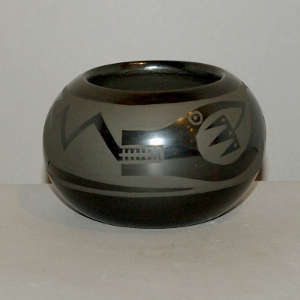 Avanyu design on a black on black jar