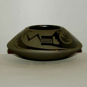 Avanyu design on a black on black jar