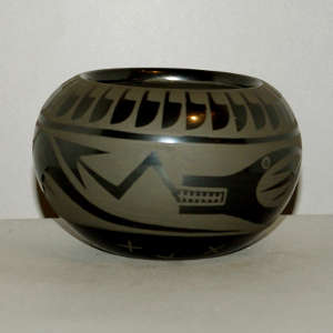 Avanyu design on a black on black jar