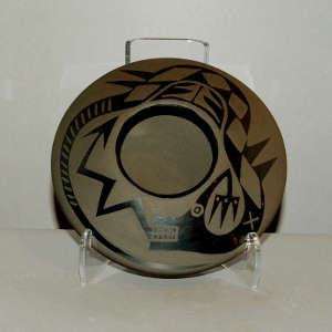 Avanyu design on a black on black jar