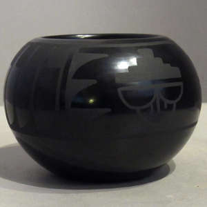 Feather and rain cloud design on a black on black jar