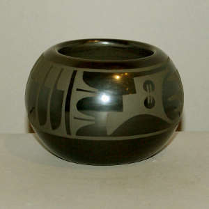 Feather and geometric design on a black on black jar