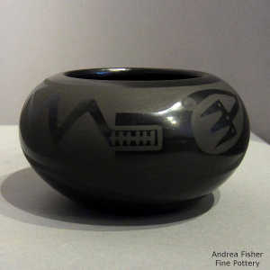 Avanyu, cloud and geometric design on a black on black jar