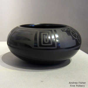 Feather, kiva step and geometric design on a black on black jar