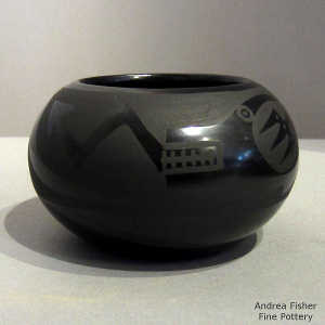 Rain cloud and avanyu design on a black on black jar