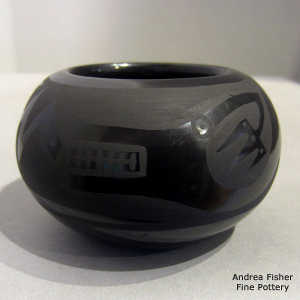 An avanyu design on a black on black bowl