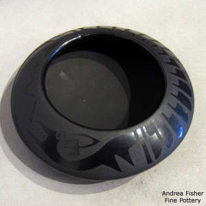 Avanyu and feather design on a black on black jar