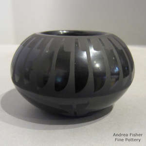 Feather design on a black on black jar