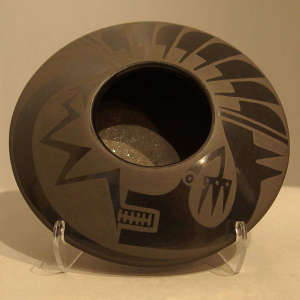 Avanyu and feather design on a black on black jar