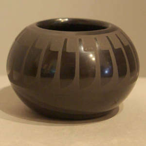 Feather design on a black on black jar