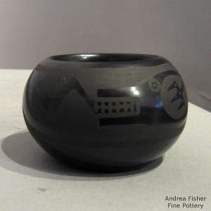 Avanyu design on a black on black jar