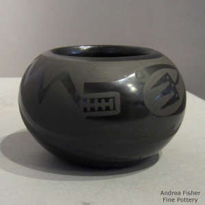 Avanyu, thundercloud and geometric design on a black on black jar