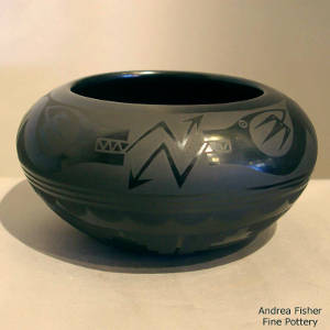 Double avanyu design on a black on black jar