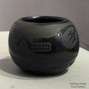 Avanyu design on a black on black jar