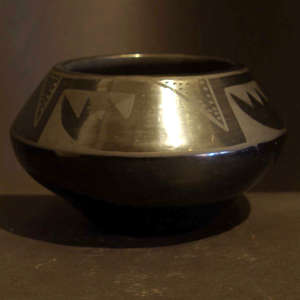 Geometric designs on a black on black jar