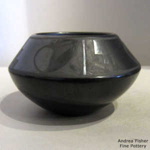 Geometric design on a black on black jar