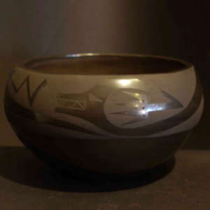 An avanyu design on a black on black bowl