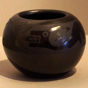 Avanyu design on a black on black jar