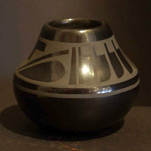 Feather design on a black on black jar