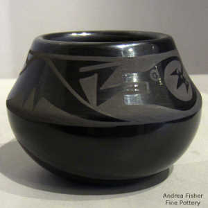 Geometric design on a black on black oval bowl
