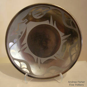 Avanyu design on a black on black gunmetal plate