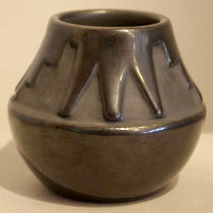 Kiva step and geometric design carved into a black jar