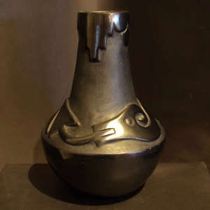 Avanyu and kiva step design carved into a black jar