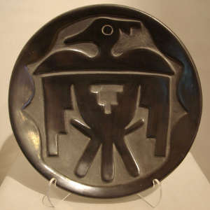 Thunderbird design carved into a black plate