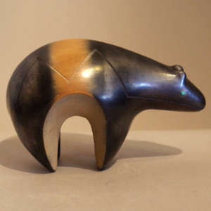 Sgraffito heart line on a gunmetal black bear with sienna stripe