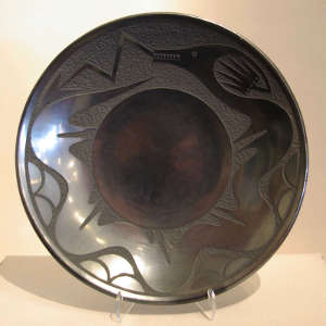 Sgraffito avanyu design on  gunmetal black plate