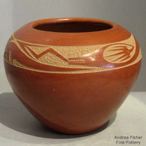 Sgraffito avanyu design on a polished red jar