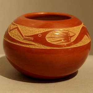 Sgraffito avanyu design on a polished red jar