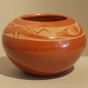 Sgraffito avanyu design on a polished red jar