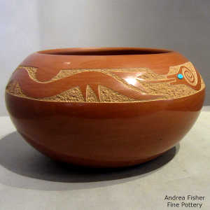 2 inlaid stones on a red jar with a sgraffito avanyu design