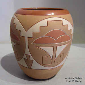 Lightly carved and painted geometric design on a polychrome jar