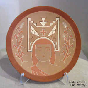 Lightly carved and painted Corn Maiden with a tablita, corn plants, lightning bolts, rain clouds and kiva steps on a polychrome plate
