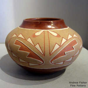 Carved, sgraffito and painted lightning bolt, kiva step, cloud and geometric design on a polychrome jar