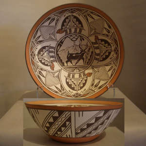 Turtle medallions, deer heart line and geometric design on a polychrome bowl