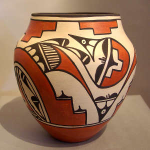 Rainbow, bird element and geometric design on a polychrome jar