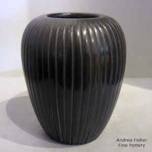 Carved black melon jar