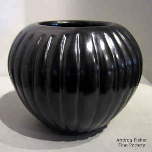 Carved black melon jar