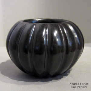Carved black melon jar
