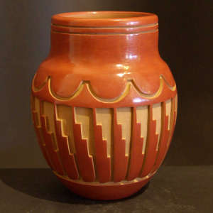 Kiva step and geometric designs carved into a red jar