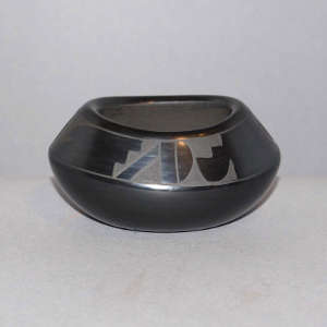 Geometric design on a black on black jar