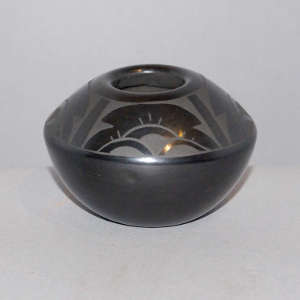 Cloud design on a black on black jar