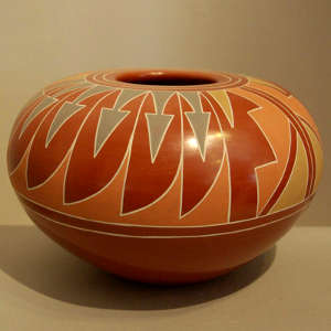 Kiva step and feather design on a polished red bowl