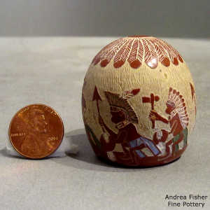 Sgraffito and painted feather and dancer design on a polychrome seed pot