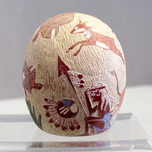 Sgraffito and painted hunter and game animal design on a miniature polychrome seed pot